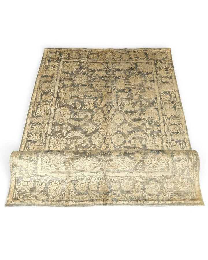 Hand-knotted charcoal Ghazni rug with gold silk floral