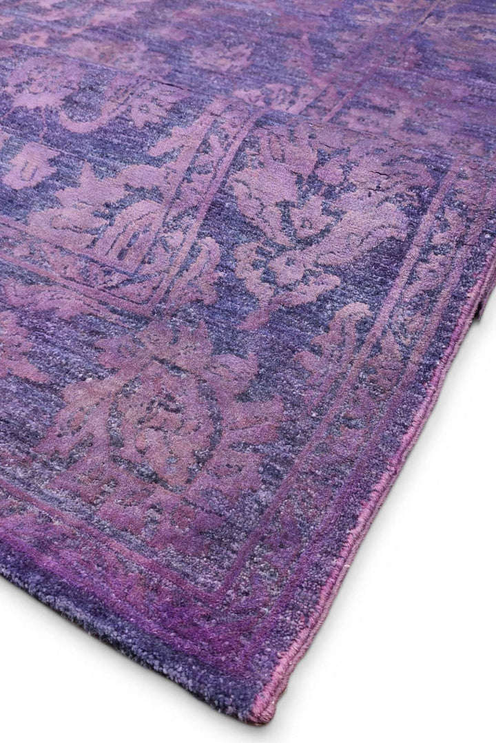 Hand-knotted purple Ghazni rug with silk floral field