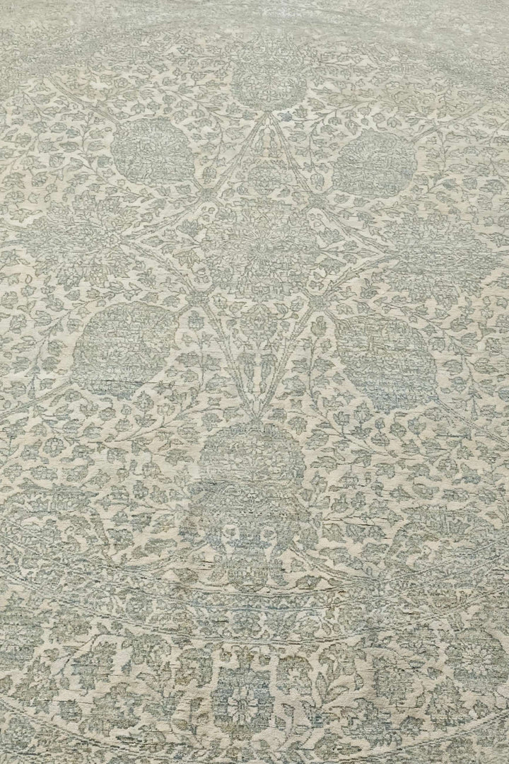 Concentric floral detail in sage and cream on round rug
