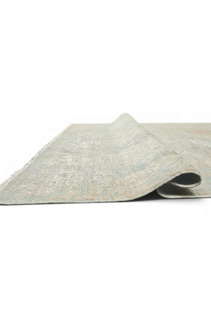 Corner of sage green floral Ghazni rug
