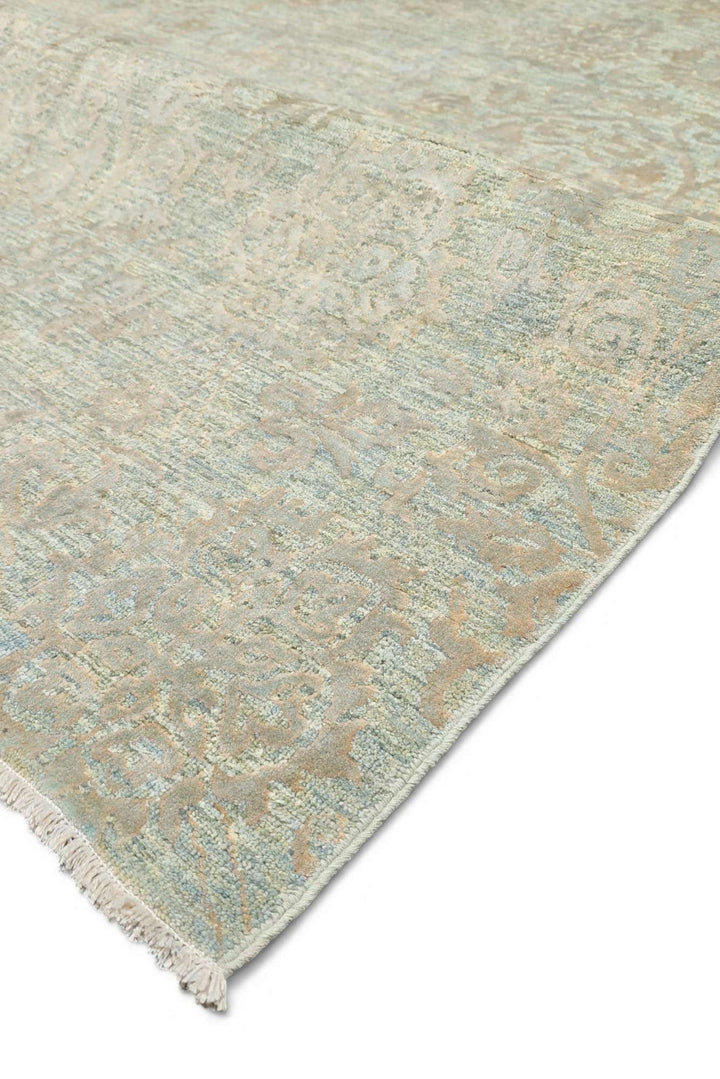 Fringe of sage green Ghazni wool and silk rug