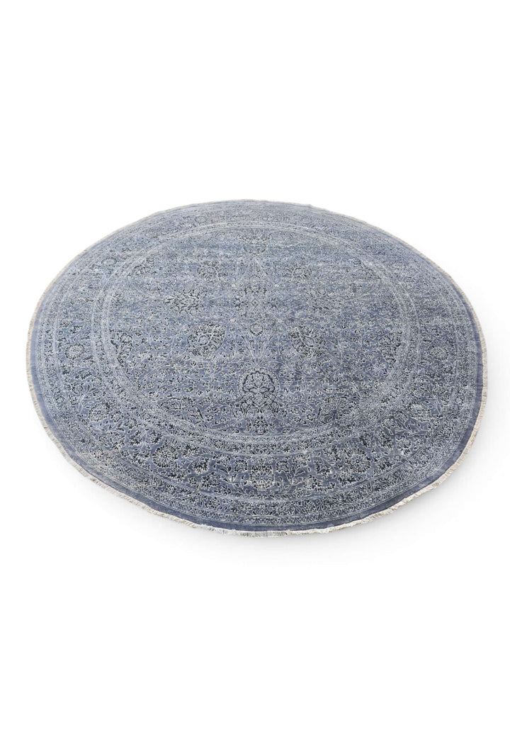 Circular edge of slate blue round Ghazni hand-knotted rug