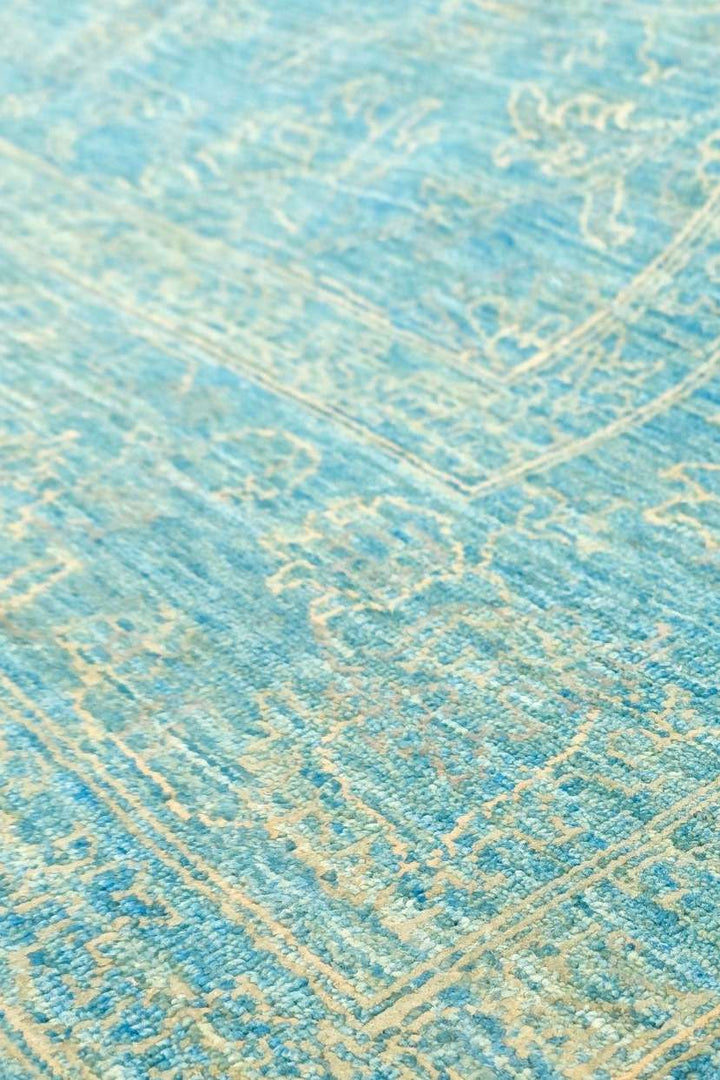 Wool and silk pile of turquoise Ghazni rug, 169×241cm