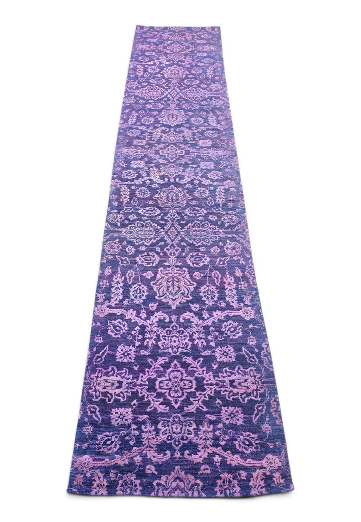 Border detail of violet and lilac hand-knotted Afghan runner