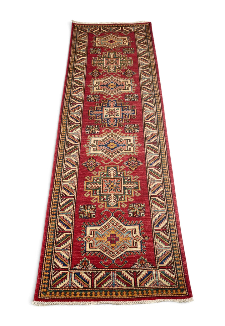 Border detail of deep red Kazak hand-knotted runner