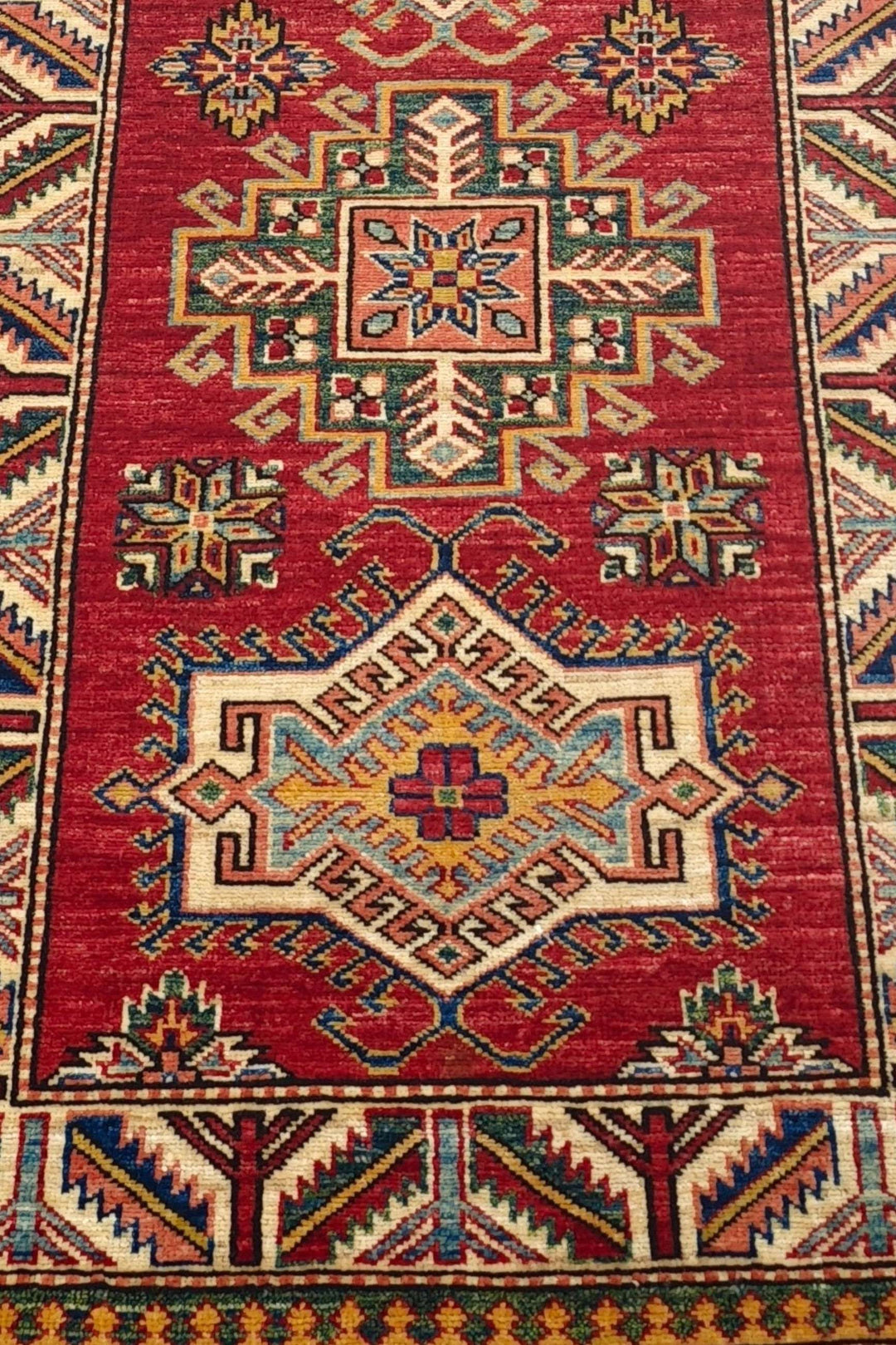 Hand-knotted Kazak runner with bold Caucasian geometry