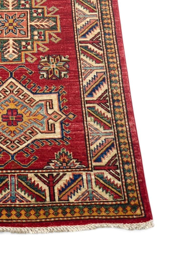 Corner of deep red Kazak hand-knotted runner