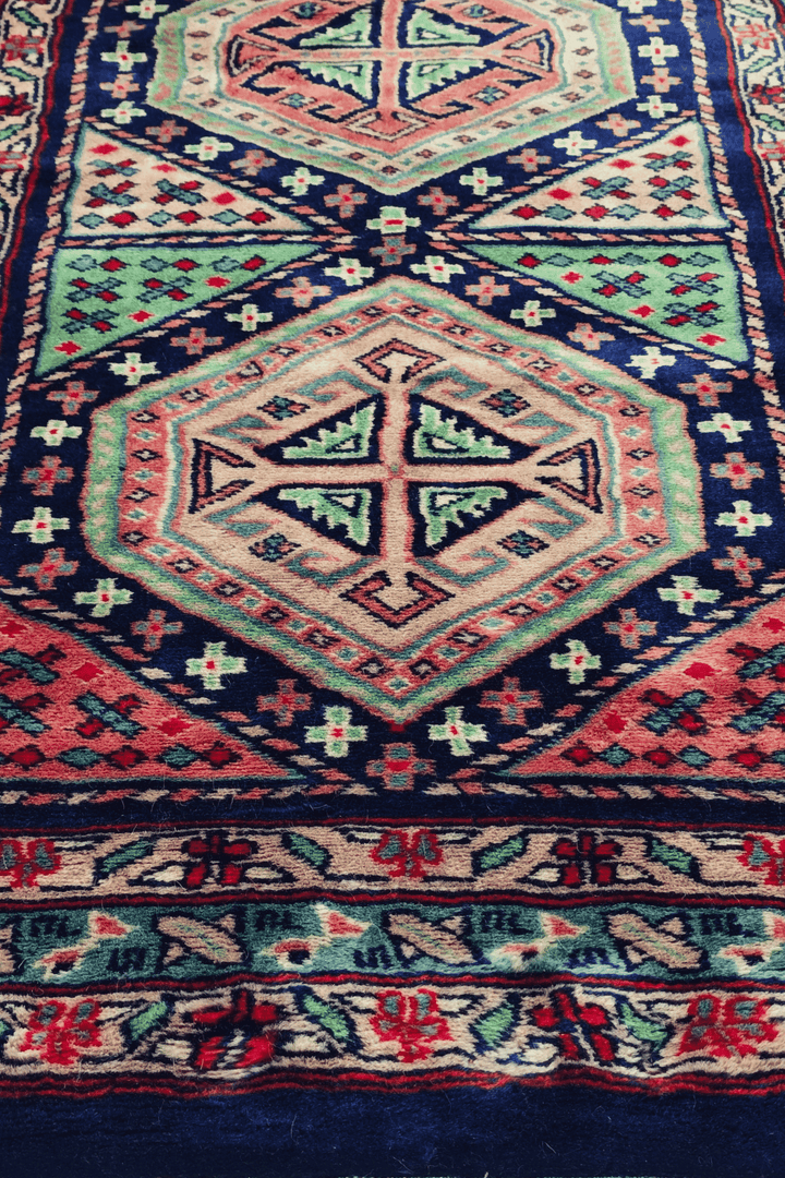 Hand-knotted Kazak runner with bold Caucasian geometry