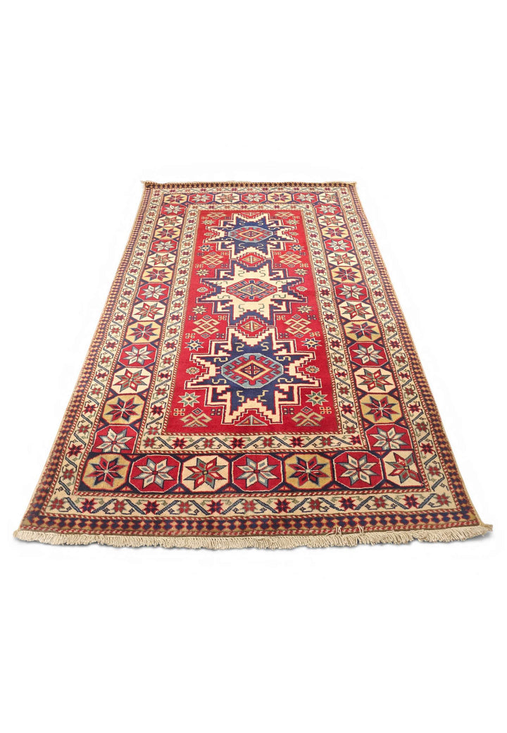 Border detail of red and ivory Kazak hand-knotted Afghan rug