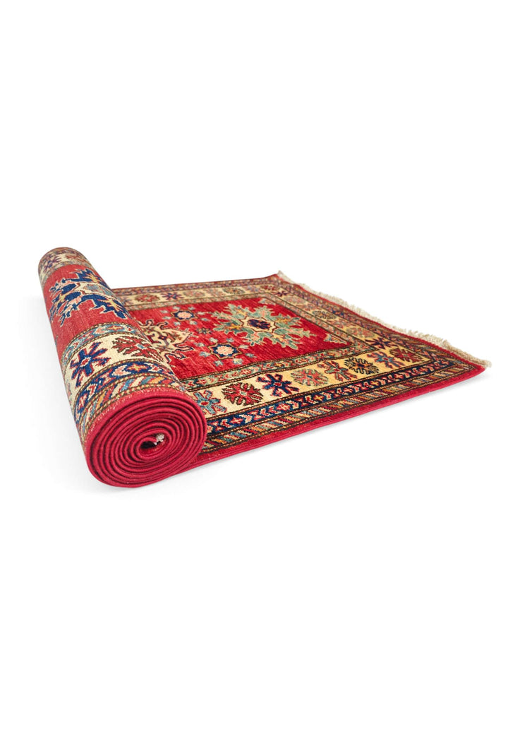 One-of-a-kind red serrated star Kazak runner