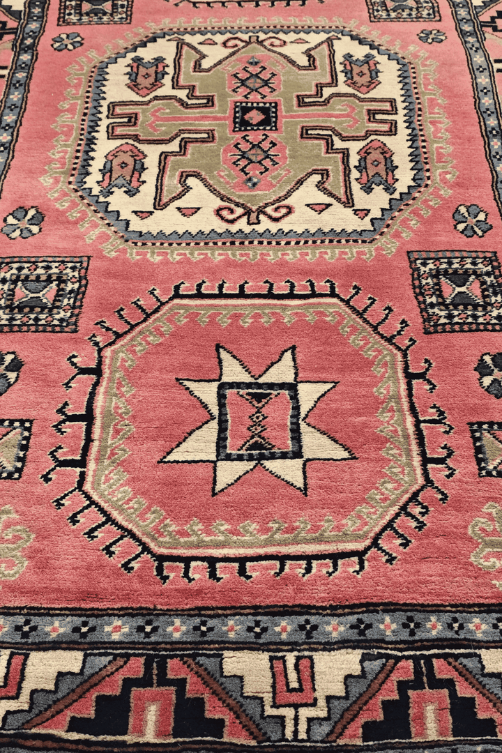 Hand-knotted Kazak rug with bold Caucasian geometry
