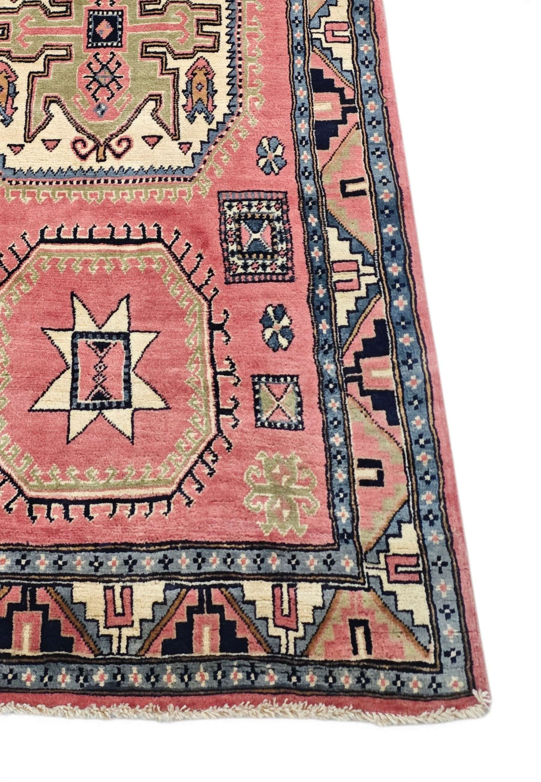 Corner of rose ivory Kazak hand-knotted rug
