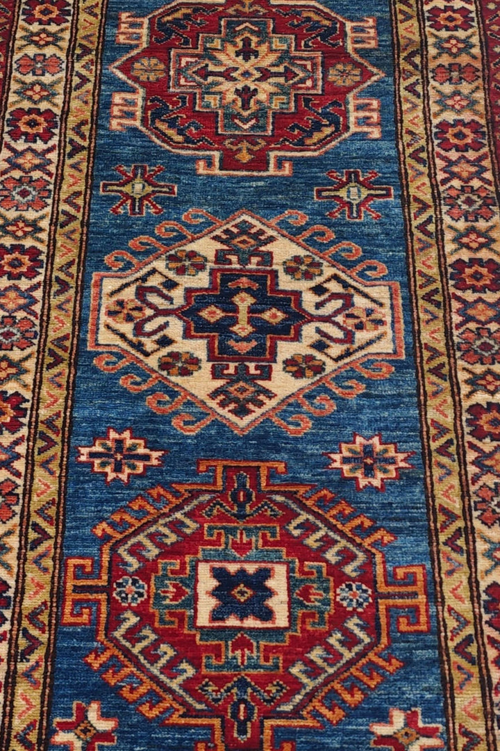 Hand-knotted Kazak rug with bold Caucasian geometry