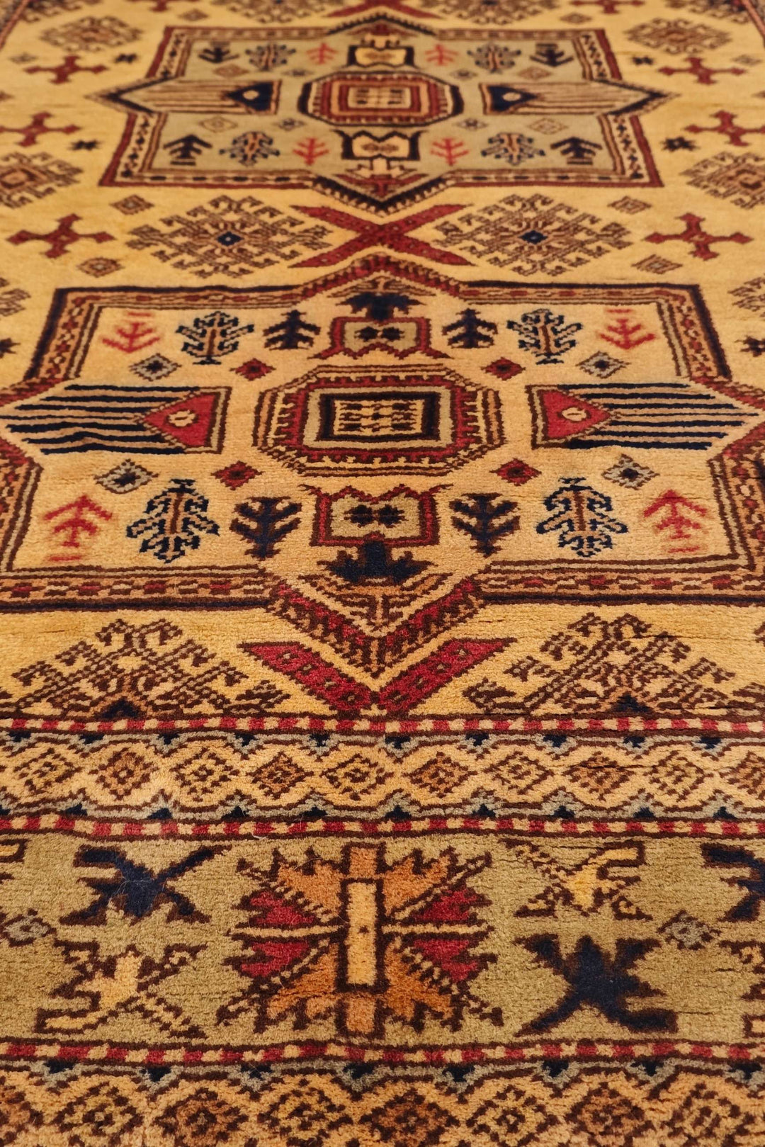 One-of-a-kind gold Caucasian star Kazak rug