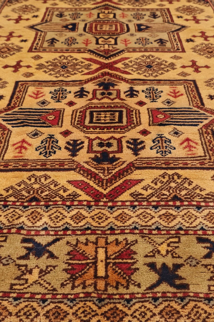 One-of-a-kind gold Caucasian star Kazak rug