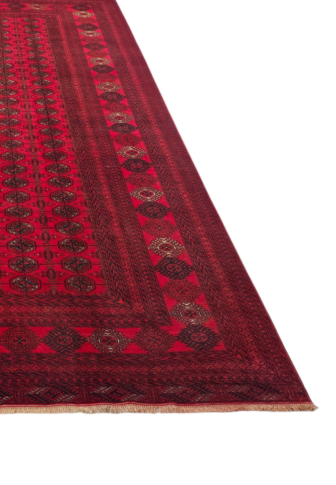 Corner of bright red Afghan Turkmen gül hand-knotted rug