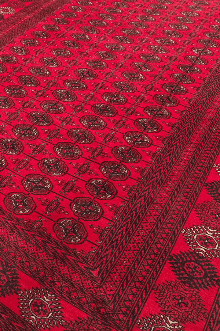 Turkmen gül motifs on bright madder red Afghan wool rug