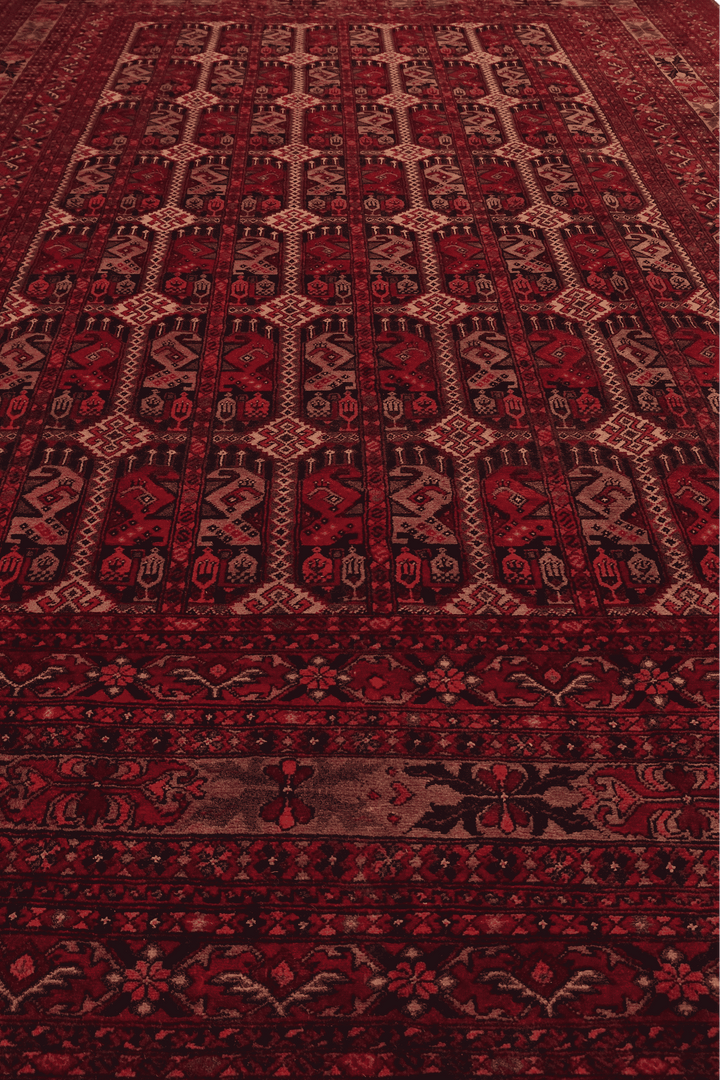 Corner of deep burgundy panel Khal Mohammadi rug