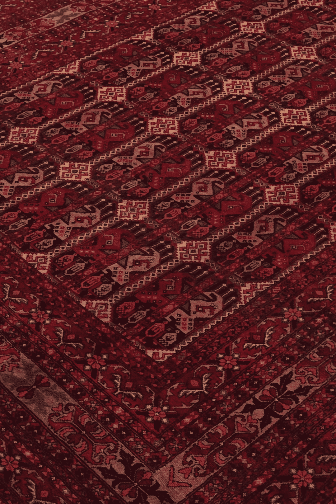 Panel detail in deep burgundy on Afghan Khal Mohammadi rug