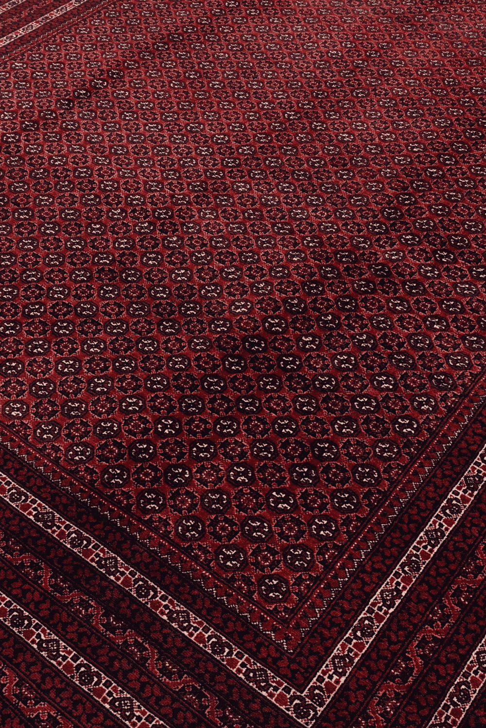 Turkmen gül motifs on deep burgundy Khoja Roshnai rug from Kunduz