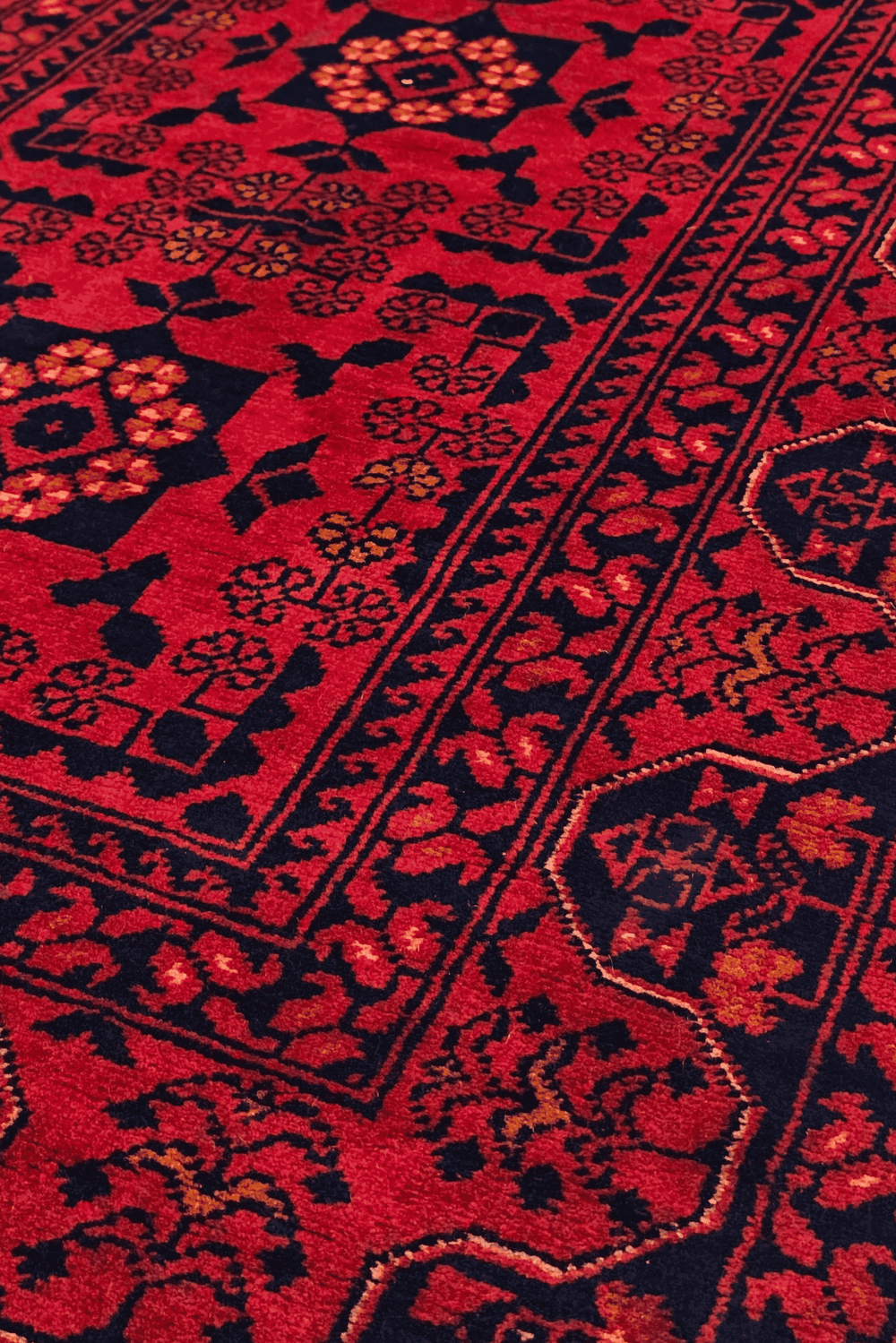 Pattern detail in coral and gold on Khal Mohammadi runner