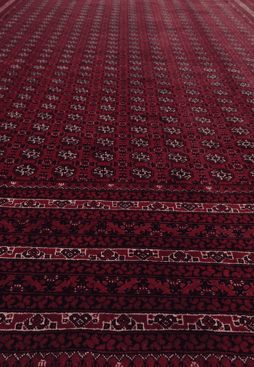 Hand-knotted deep wine Roshnai rug with Turkmen güls