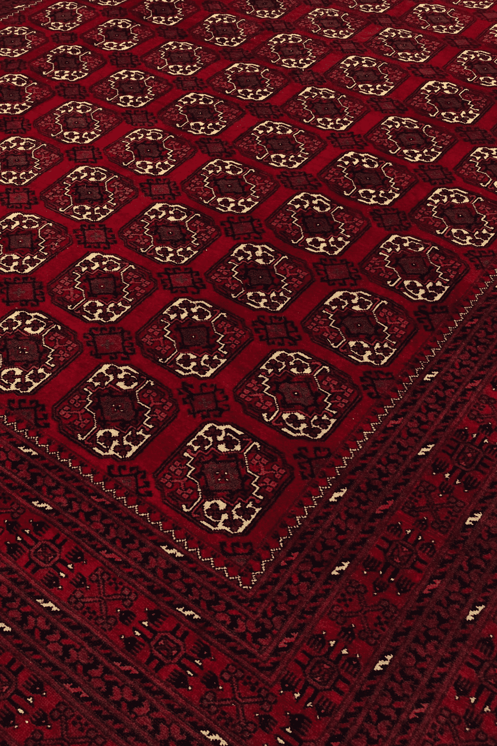 Turkmen gül motifs on oxblood Bashiri Afghan wool rug