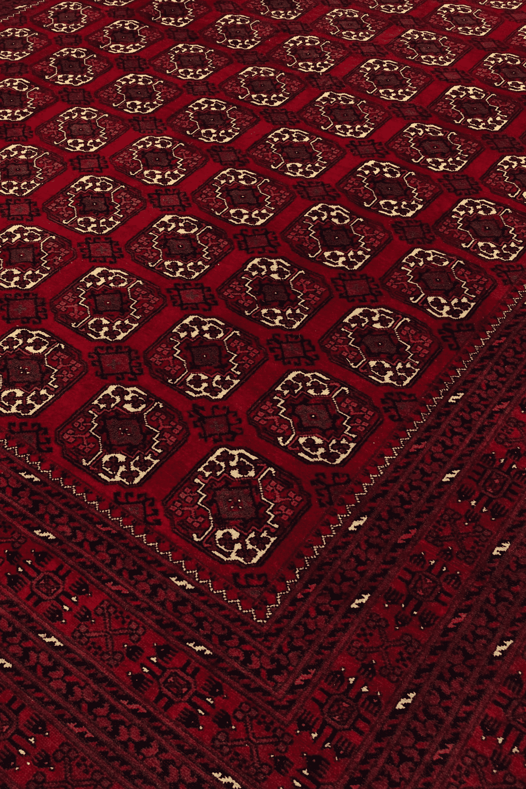 Turkmen gül motifs on oxblood Bashiri Afghan wool rug