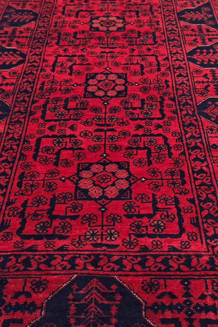Hand-knotted Khal Mohammadi runner in deep madder red