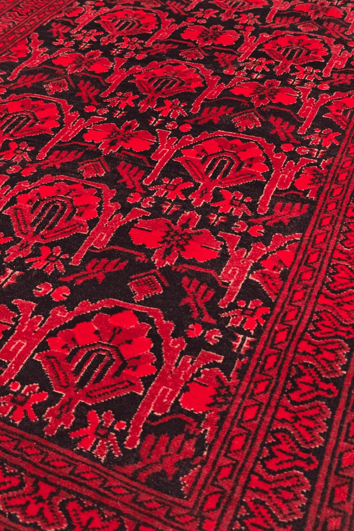 Pattern detail in red and black on Khal Mohammadi rug, 76×186cm