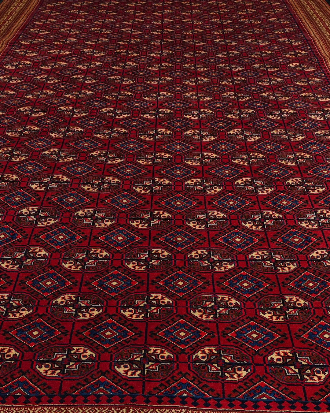 Border detail of red Yomut hand-knotted Afghan Sherwan rug