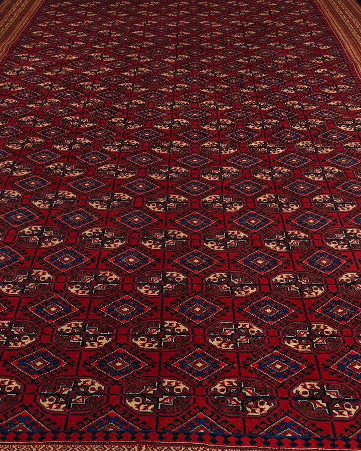 Border detail of red Yomut hand-knotted Afghan Sherwan rug