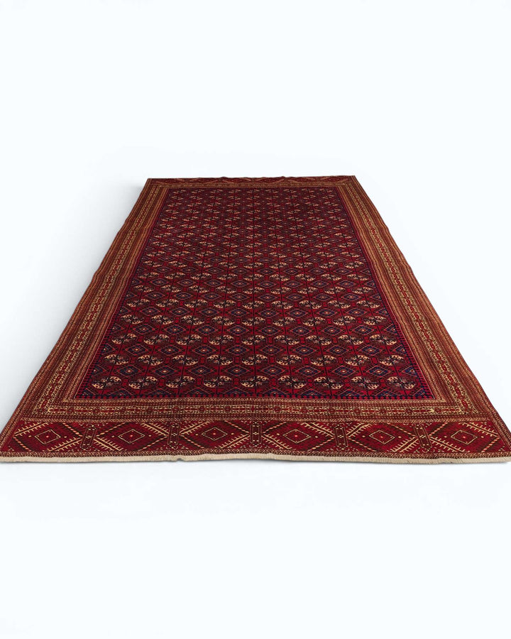 Hand-knotted wool pile of red Yomut Turkmen rug