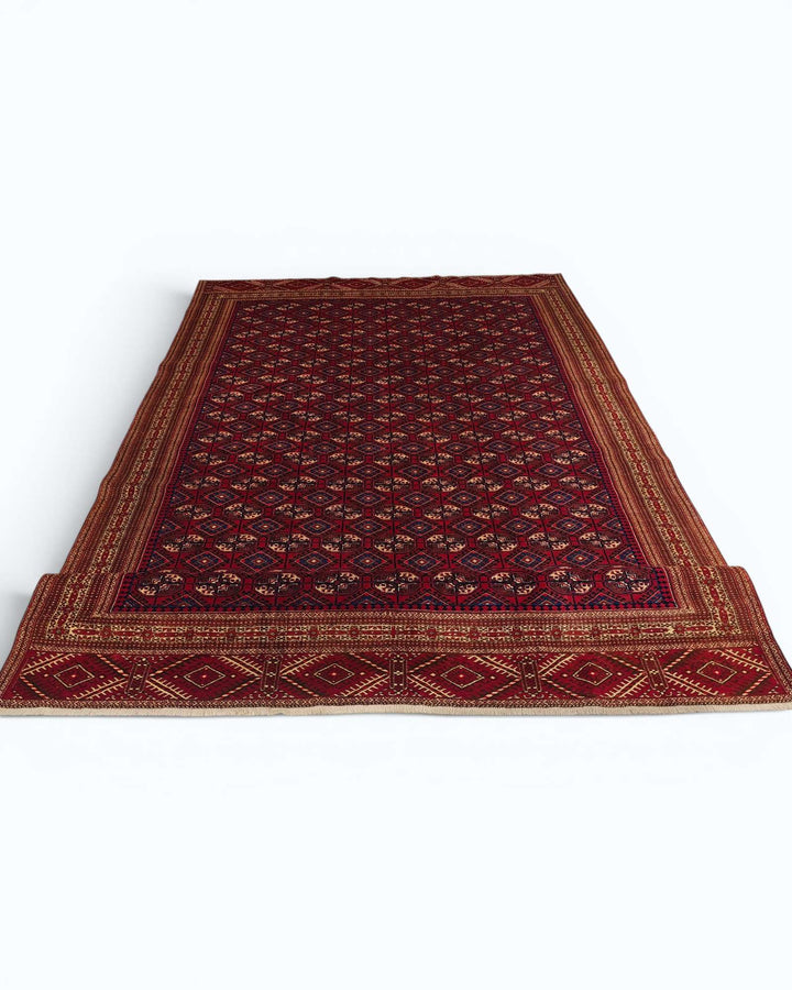 One-of-a-kind red Yomut Turkmen Afghan Sherwan rug