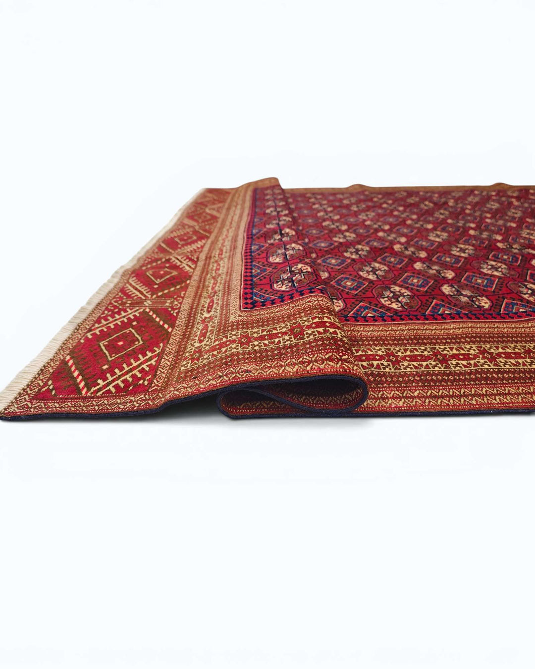 Hand-knotted red Afghan rug with Yomut Turkmen güls