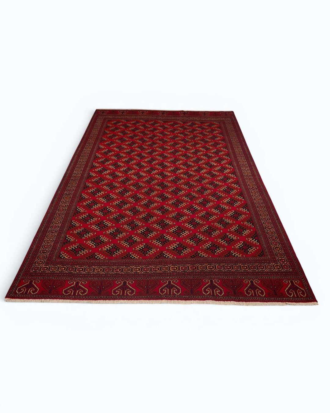 Hand-knotted wool pile of red Saryk Turkmen rug