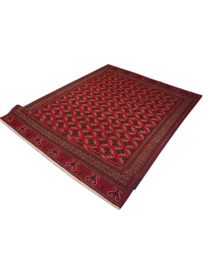 Hand-knotted red Afghan rug with Saryk Turkmen güls