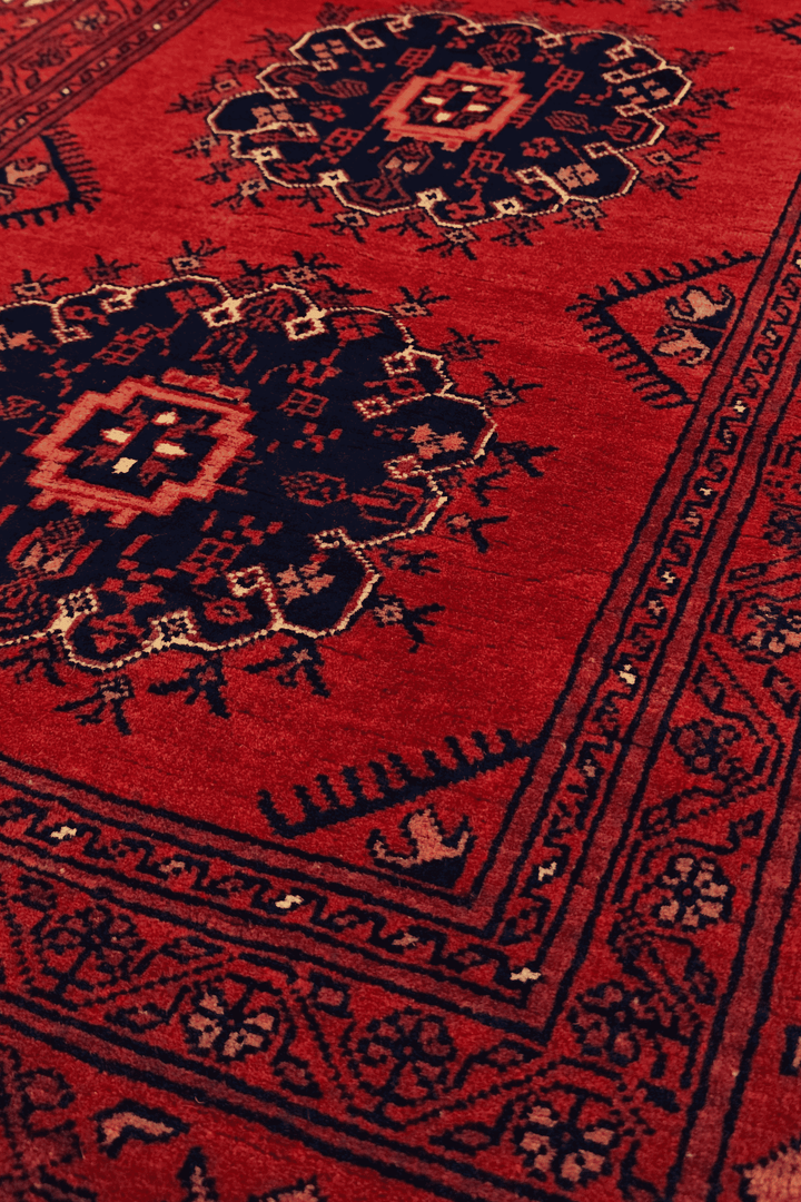 Pattern detail in red and navy on Khal Mohammadi runner