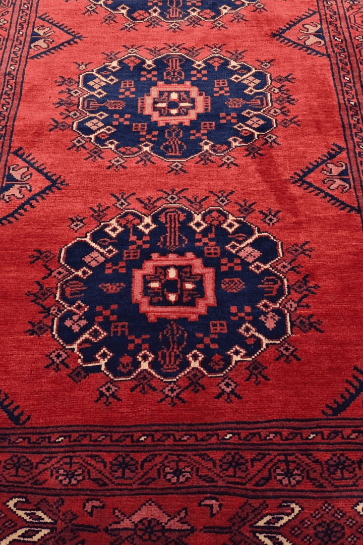Hand-knotted Khal Mohammadi runner in deep madder red