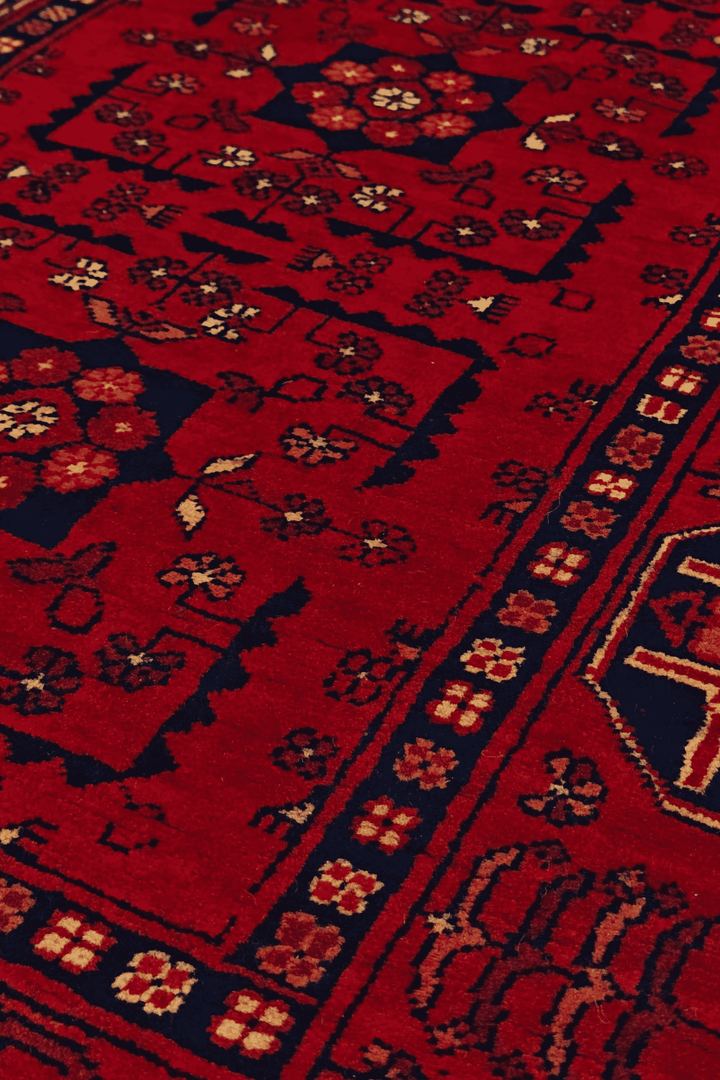 Pattern detail in red and navy on Khal Mohammadi rug, 83×184cm