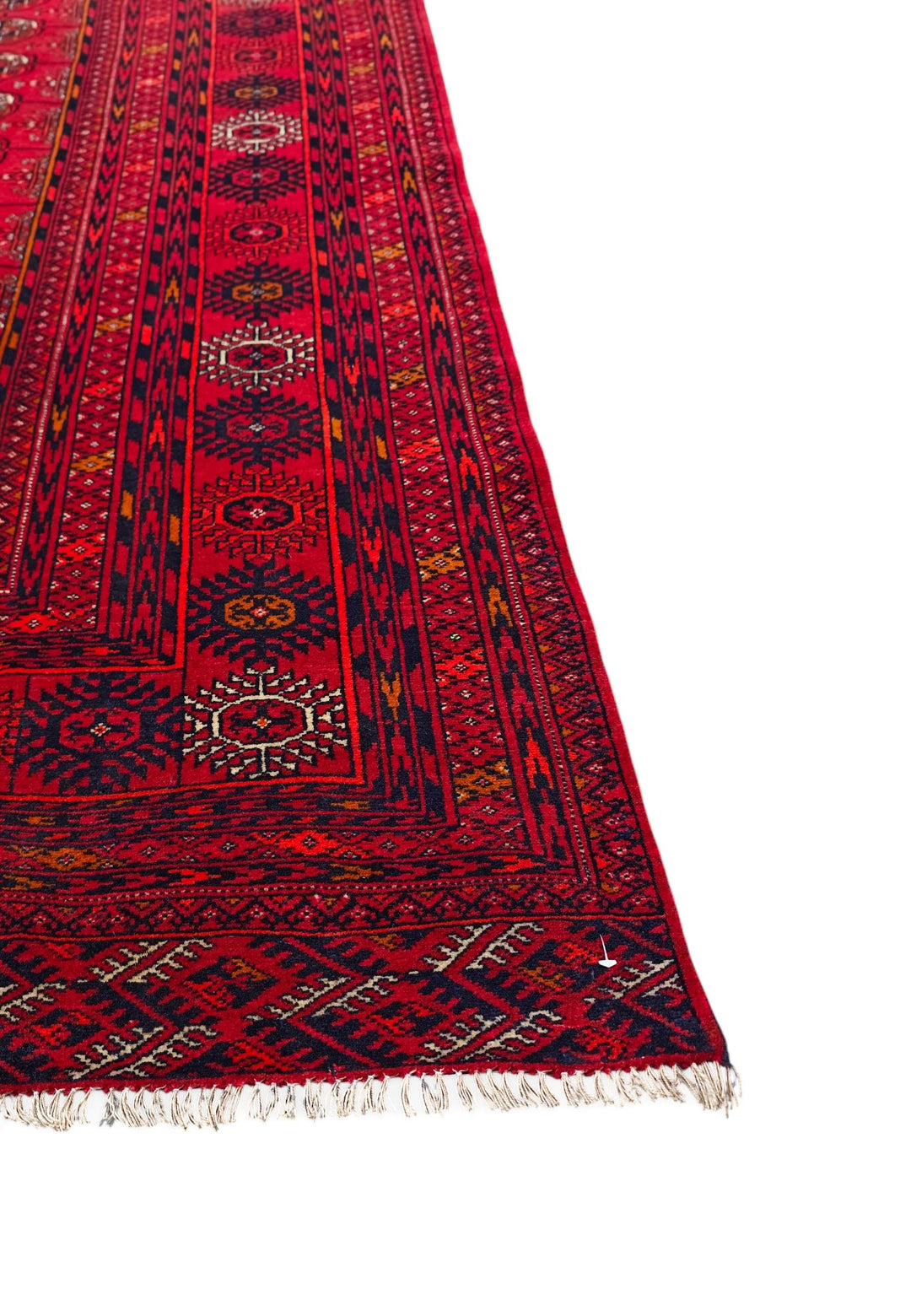 Corner of ruby red Khal Mohammadi hand-knotted rug