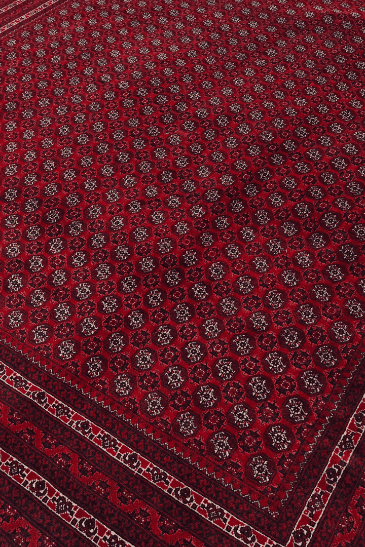 Turkmen gül motifs on wine red Khoja Roshnai rug from Kunduz