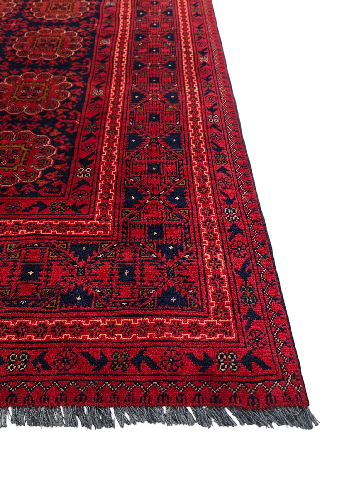 Corner of wine red Bashiri hand-knotted Afghan rug