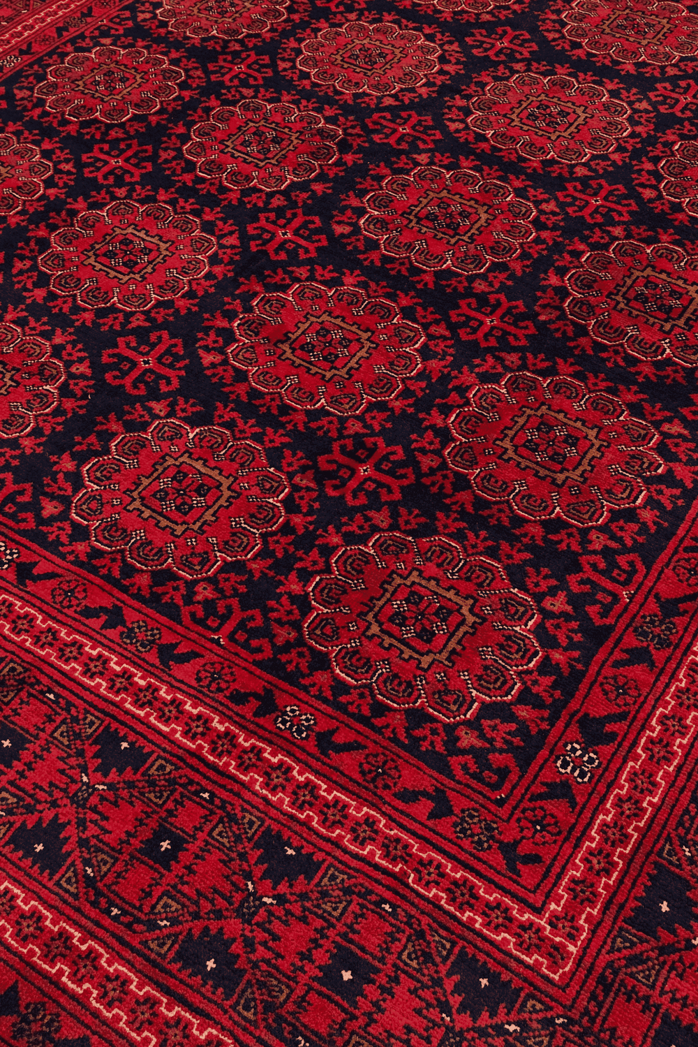 Turkmen gül motifs on wine red Bashiri Afghan wool rug
