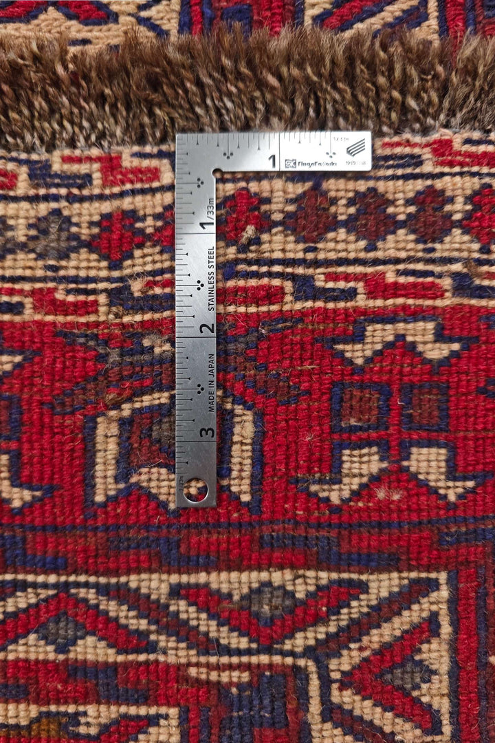 Corner of deep red and camel Turkmen hand-woven kilim