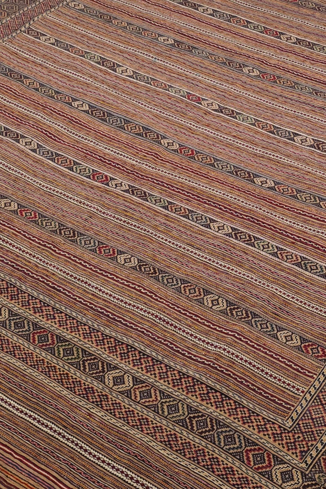 Banded detail in taupe and cream on Afghan kilim