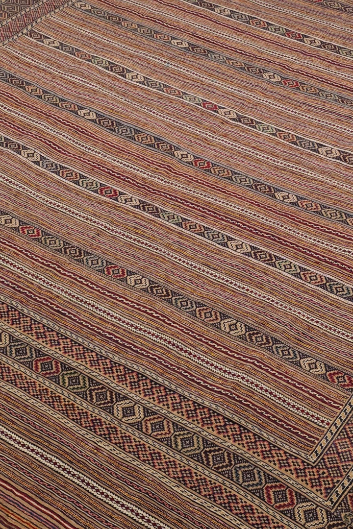 Banded detail in taupe and cream on Afghan kilim
