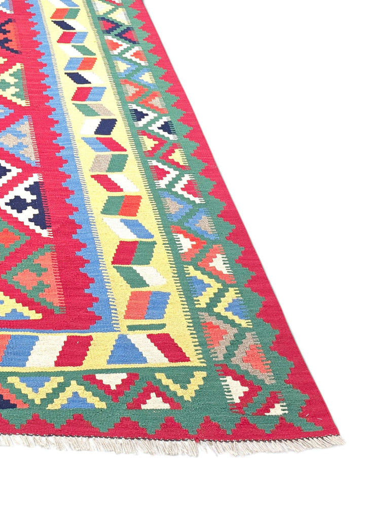 Corner of cerise Qashqai hand-woven kilim