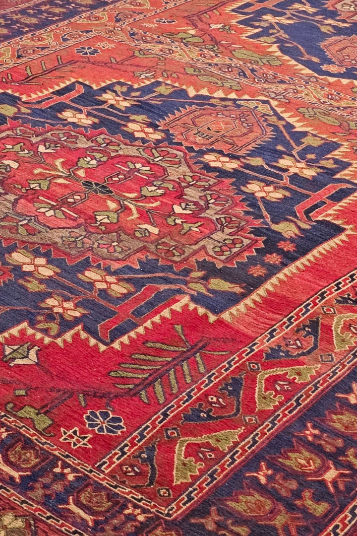 Twin medallion detail in red and navy on Afghan kilim