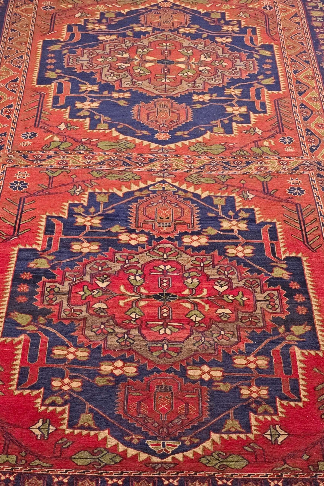 One-of-a-kind red and navy twin medallion Afghan kilim